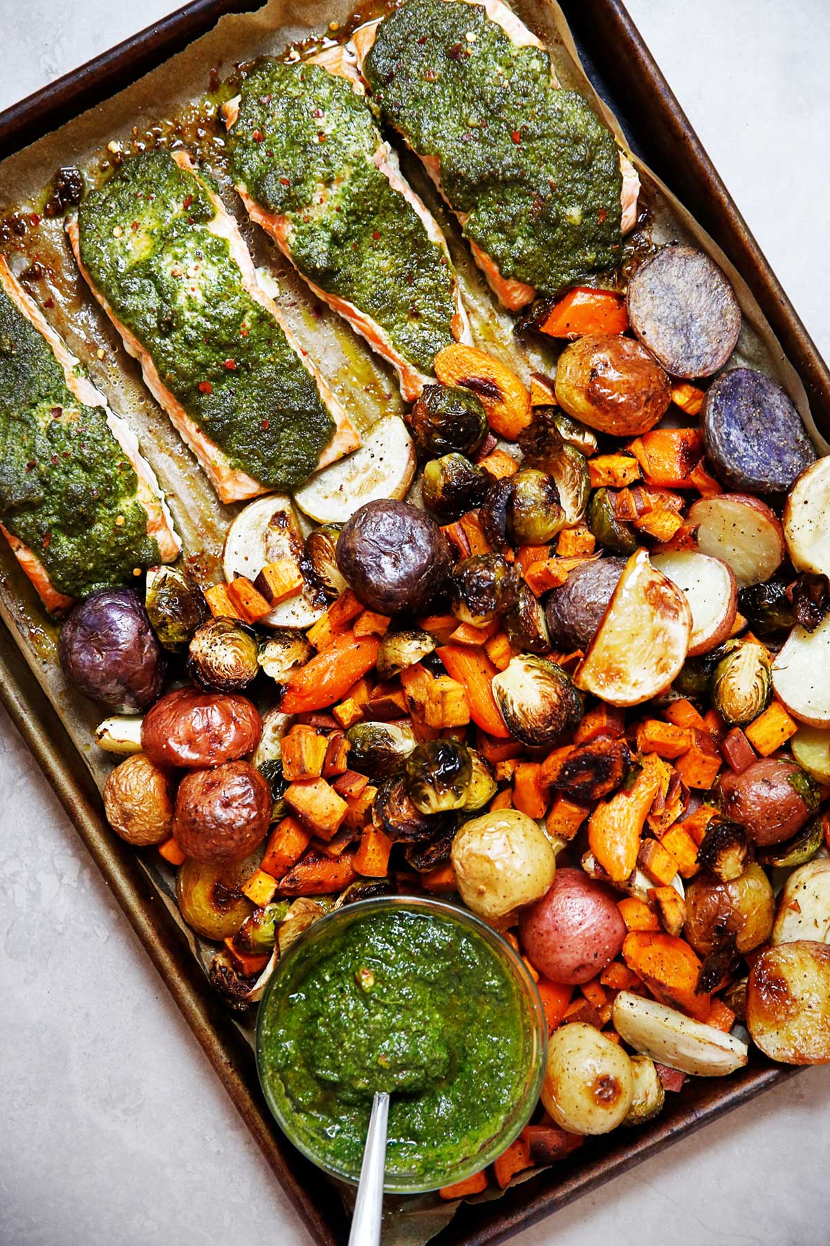 sheet pan root vegetable salmon with pesto